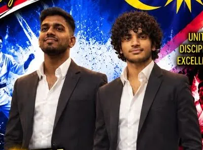 Two Perak Legends coaches in dark suits